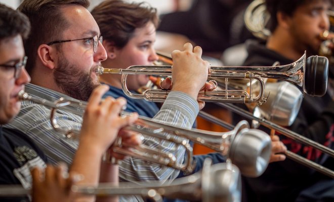 Gavin Ard rehearsing trumpet with Wind Symphony