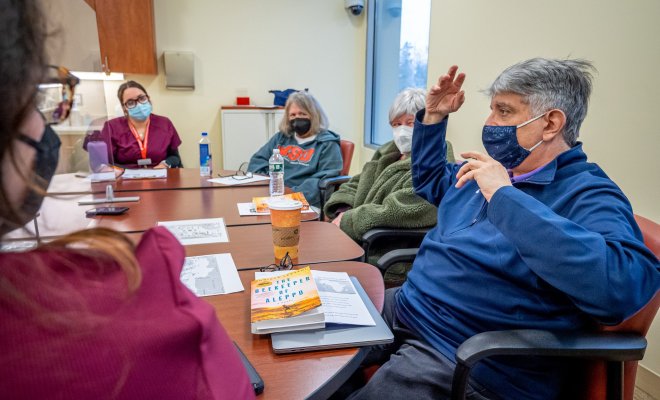 Members of the Aphasia Book Club seated around a table