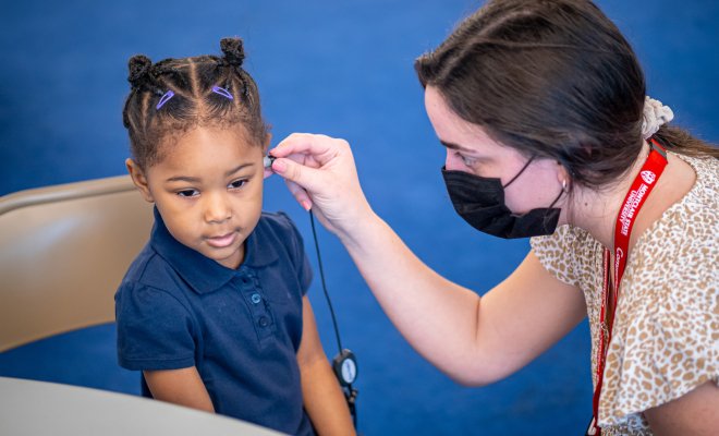 Montclair audiology student Nicole Genser administering a hearing test