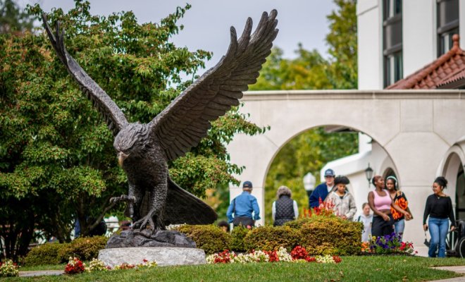 Red Hawk Statue with Cole Hall in the Background