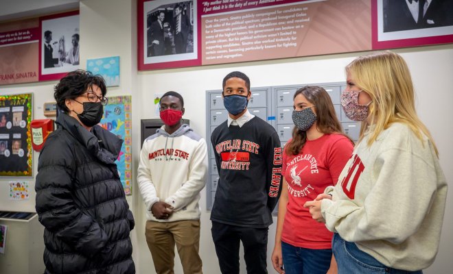 Tina Sinatra speaking with students on campus