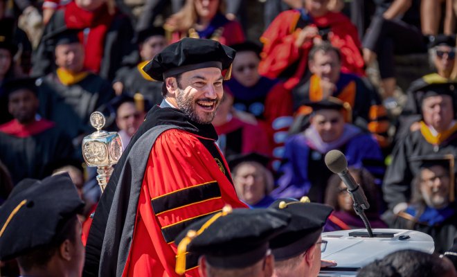 President Koppell smiles at attendees on campus