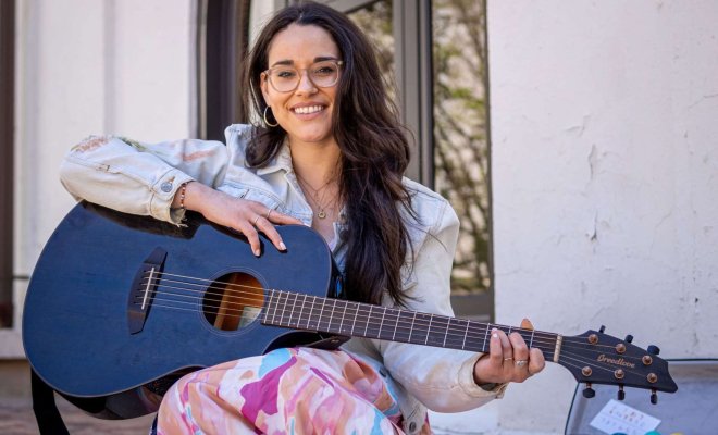 Alyssa Muñiz with guitar