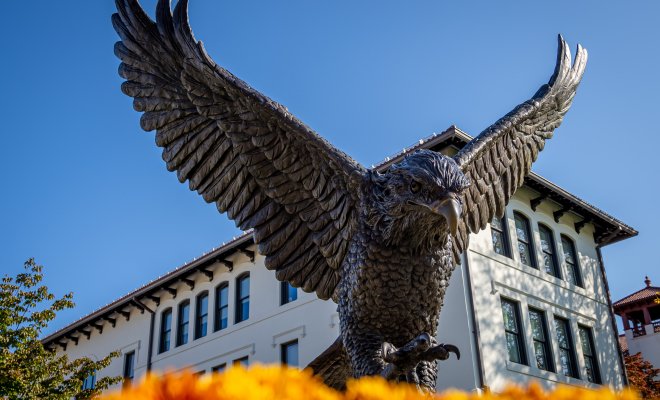 Rocky statue with flowers