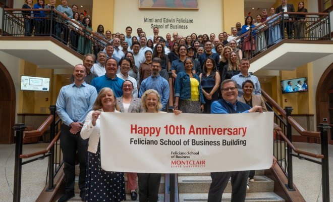 Feliciano faculty and staff group photo commemorating the 10 year anniversary