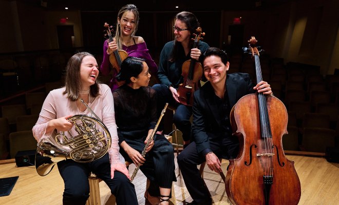 Music students on stage laughing
