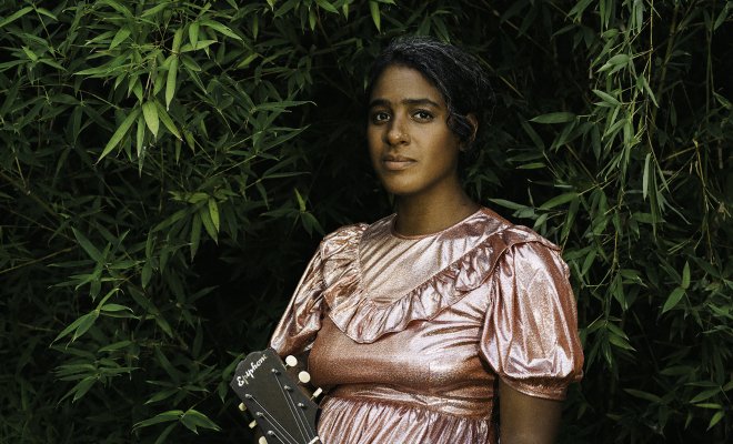 Leyla McCalla with guitar