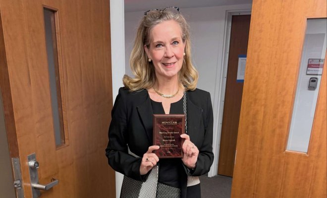 Karen Driscoll holding award received