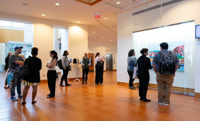 Visitors to an opening reception for University Galleries in October 2024