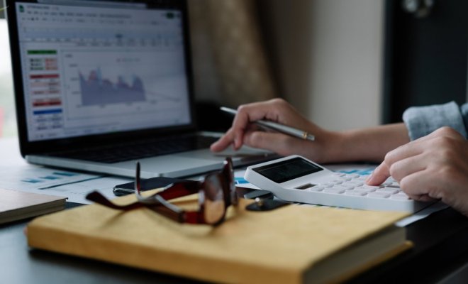 Image of calculator and laptop