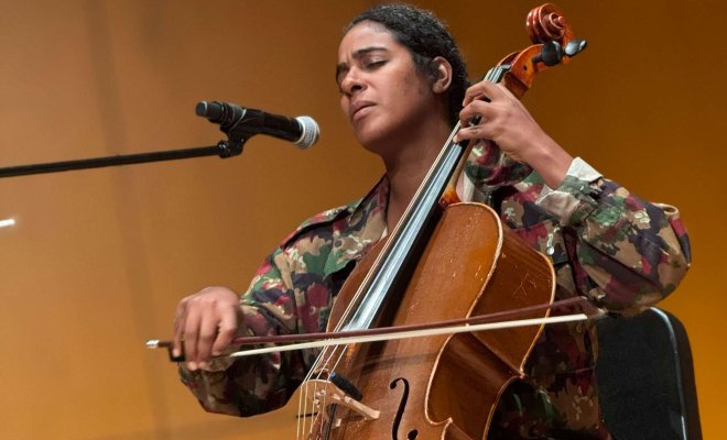 Leyla McCalla and cello on stage performing