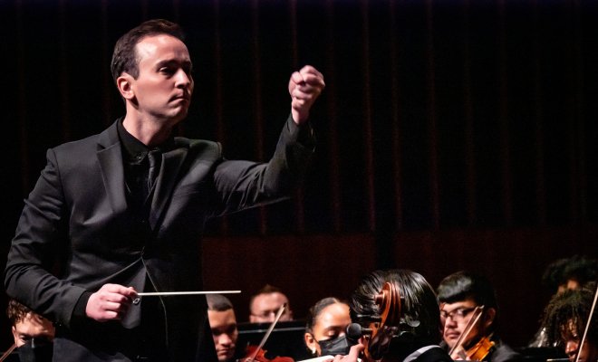 Conductor conducting orchestra