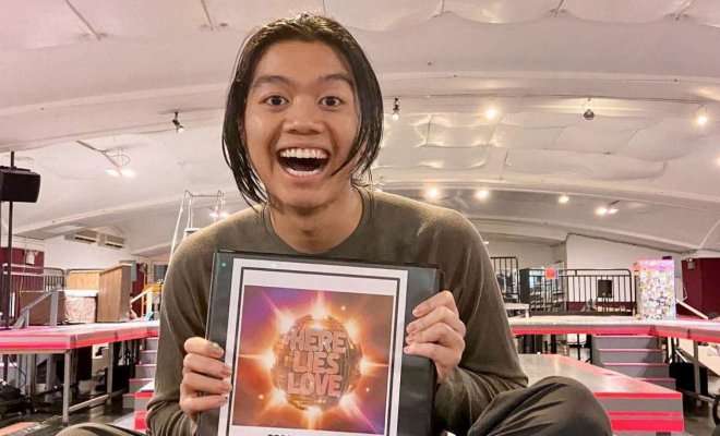 Nathan Angelo, a BFA Musical Theatre major, holds a copy of his script as he announces on Instagram his Broadway debut in the ensemble of the original Broadway cast of Here Lies Love. (Photo courtesy Nathan Angelo)