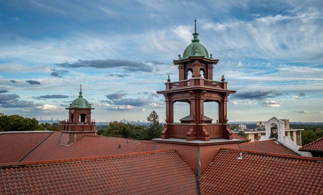 Aerial photograph depicting the roof of Cole Hall and a scenic view of the sky