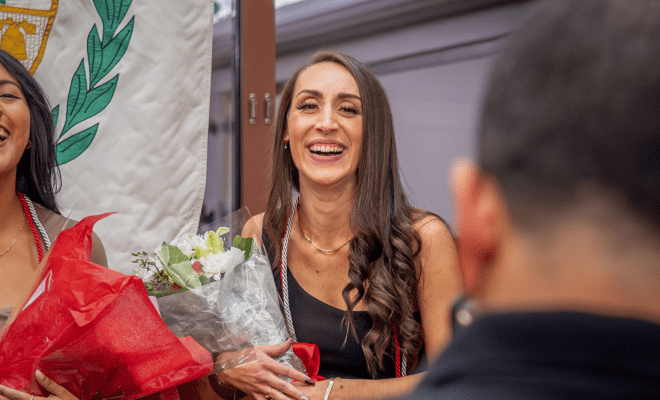 Dina poses for photos at the AEL induction ceremony.