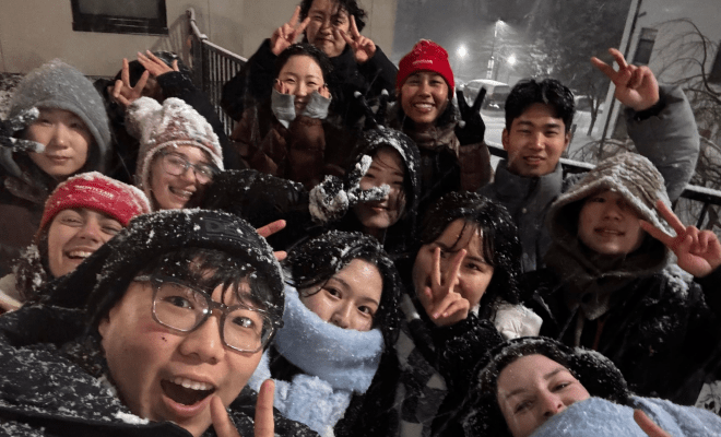 Inbound Exchange Students January 2025 Outside Residence Hall in the Snow