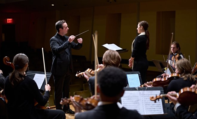 Chamber orchestra on stage with Isabel Leonard