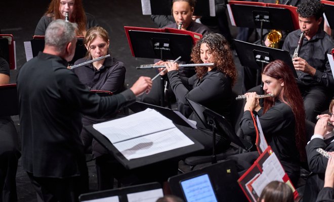 Woodwind section performing on stage for Kaleidoscope 