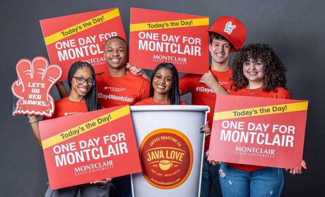 students holding up one day for montclair signs