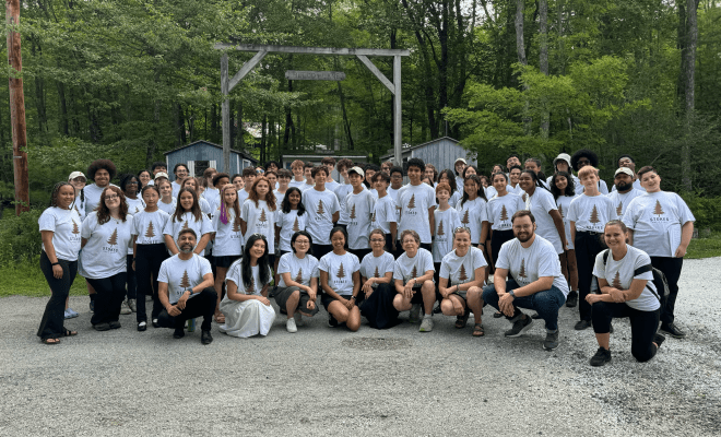 Stokes Campers in white camp shirts in group photo