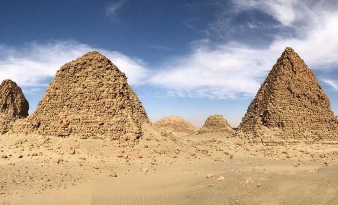 Four stone pyramids of different sizes stand at the Royal Cemetery of Nuri in Sudan