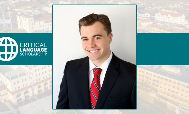 Portrait of a young man in a suit beside a logo for "Critical Language Scholarship"