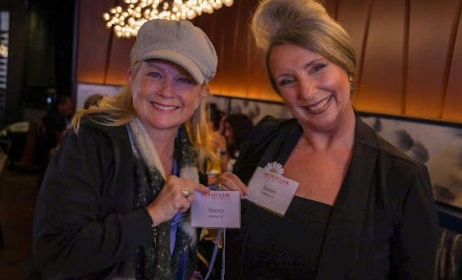 two women smiling at the NJEA gathering