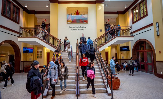 Students walking in Feliciano Atrium