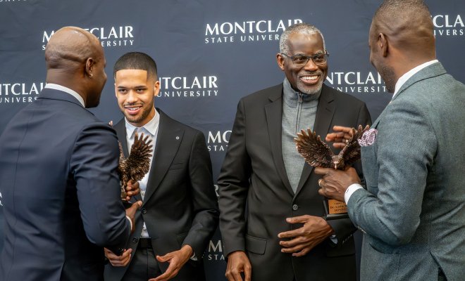 Trailblazer Award honorees, Tommy Foster, left and Professor Leslie Wilson, share a moment with Montclair leaders during the MEGA Symposium, celebrating mentorship, academic excellence and the next generation of college graduates. (Photo by Ian Peters)