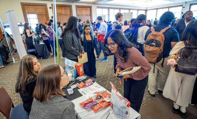 Student speaking with employer at Career Fair