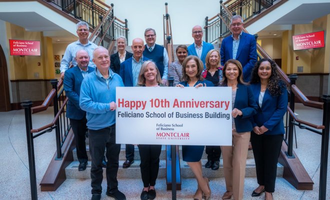 Advisory board members on atrium steps