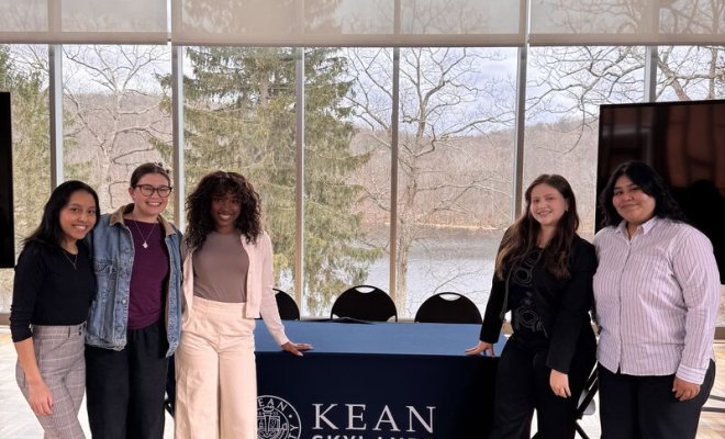 Students from Montclair and Kean pose for a group photo.