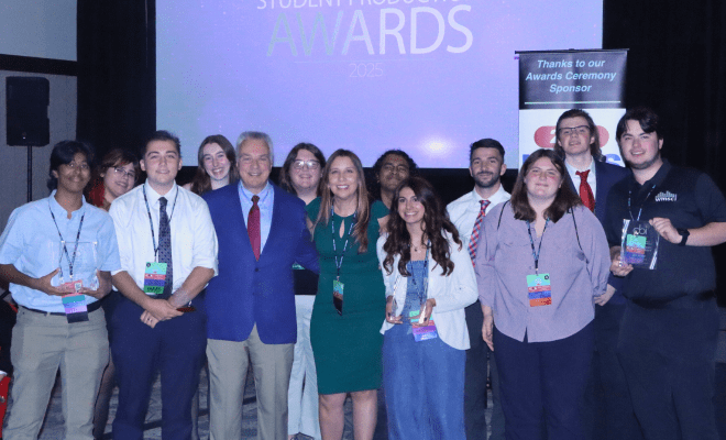 Students and professors pose on stage at the CBI Awards.