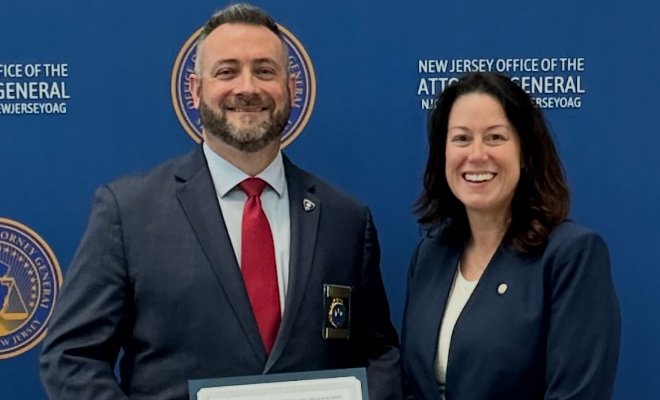 Chief Timothy Fox and NJ Attorney General Jennifer Davenport pose for a photo