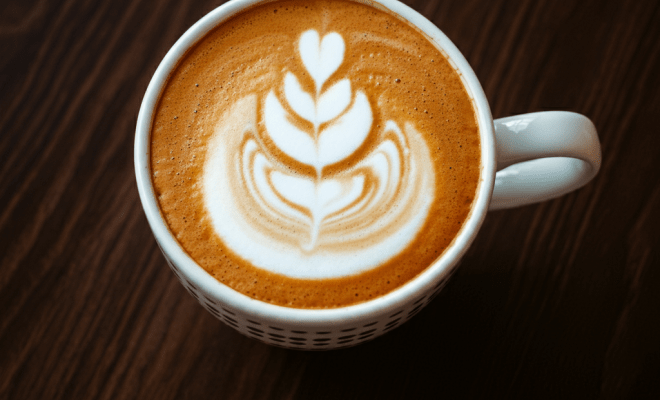 Birds eye view of a latte with a pretty foam design.