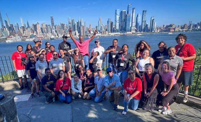 Students and professor pose for a group photo at the Weehawken waterfront.