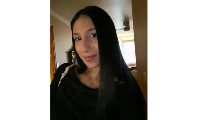 A selfie of a woman dressed in black
