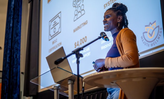Jillian Faulks presenting pitch with computer