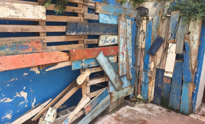 A dilapidated driftwood wall 