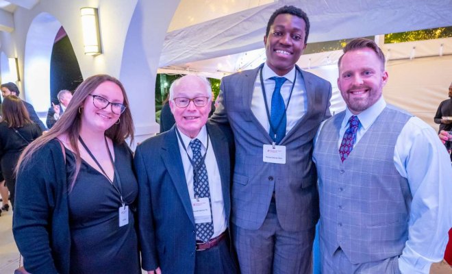 Kenneth Malmud ’76 (second from left), standing with Student Government Association (SGA) Treasurer Camryn Wade ’23 (left), SGA President Richard Steiner-Otoo (third from left) and Chris Fitzpatrick ’04, at the University’s Donor Celebration on campus in April.
