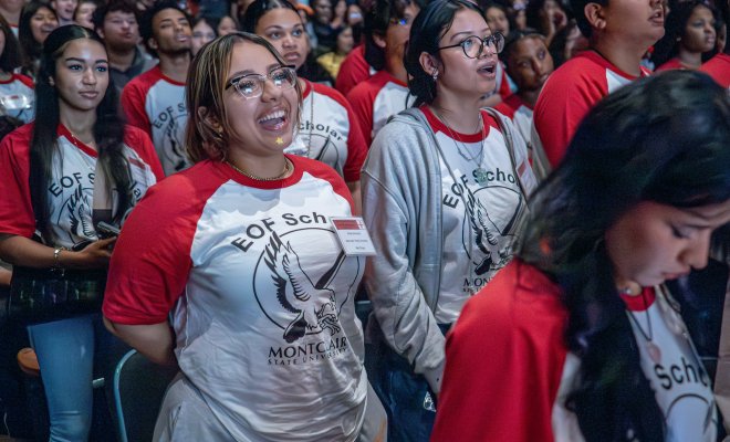 Students at an EOF conference wearing EOF Scholars shirts.
