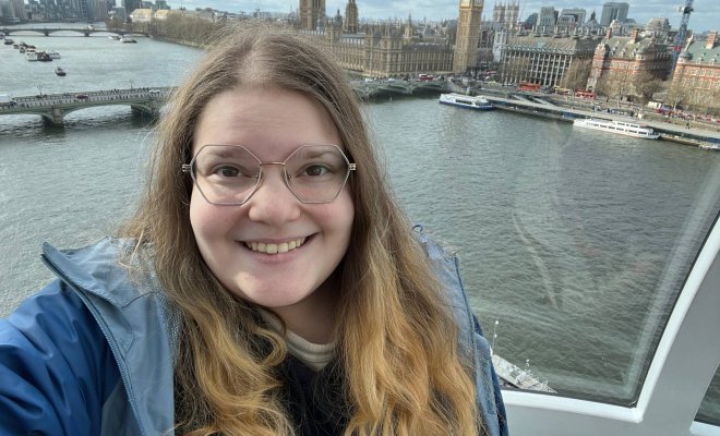 A woman takes a selfie with the British Parliament from the London Eye