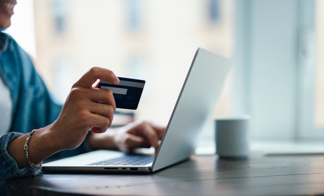 Photo of credit card and laptop 