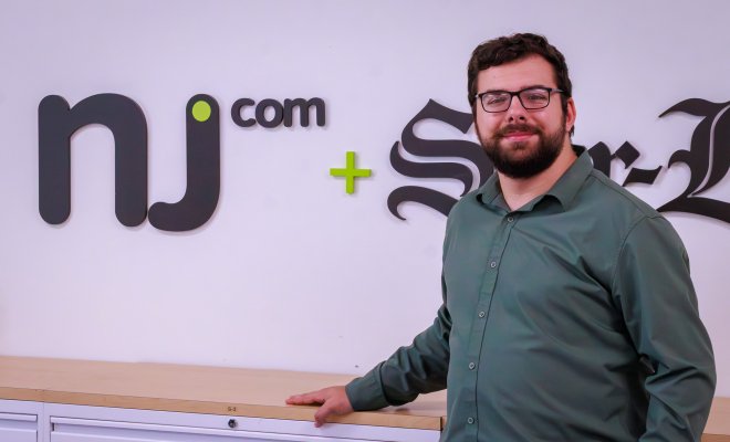 Student headshot of CCOM alum Sal DiMaggio in front of the NJ.com sign.