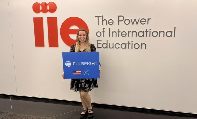 Eveita Meiersone holding sign