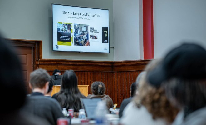 attendees viewing a powerpoint slide