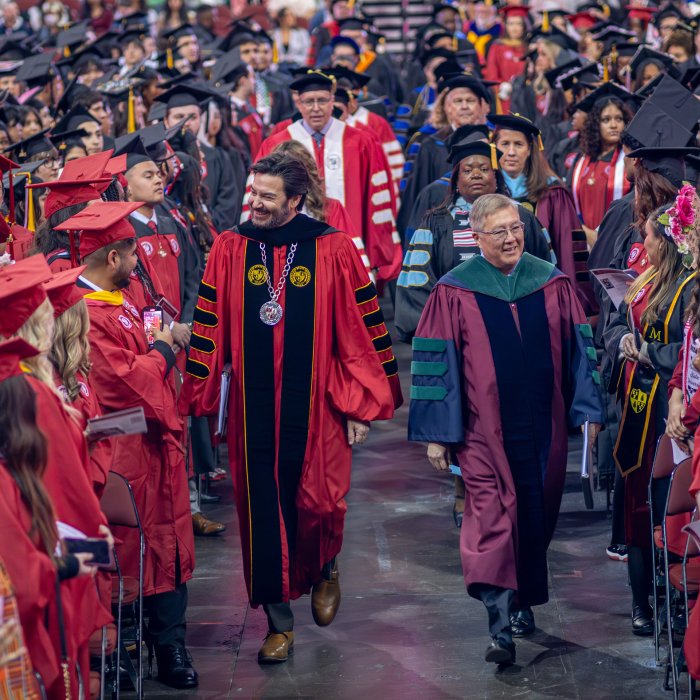 Montclair President Jonathan Koppell, on the left, and Provost Junius J. Gonzales, on the right, lead faculty and staff in the ceremonial procession.