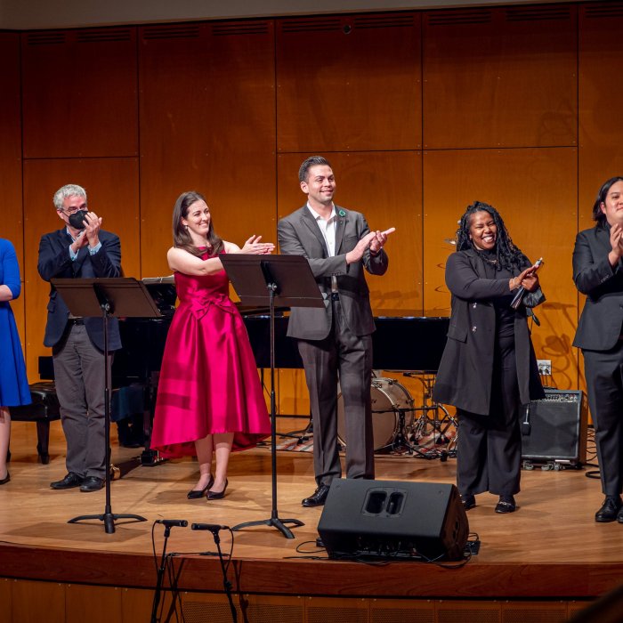 Musicians clapping on stage