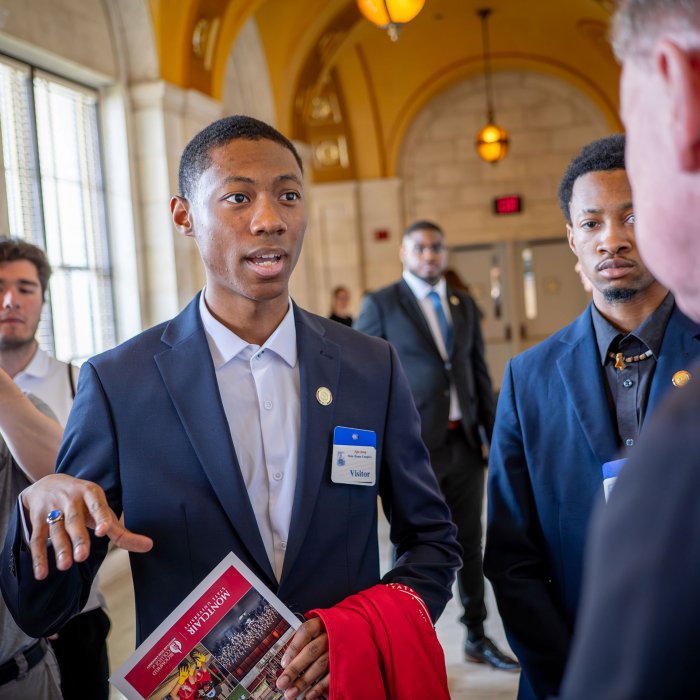 A student talks to a state senator.