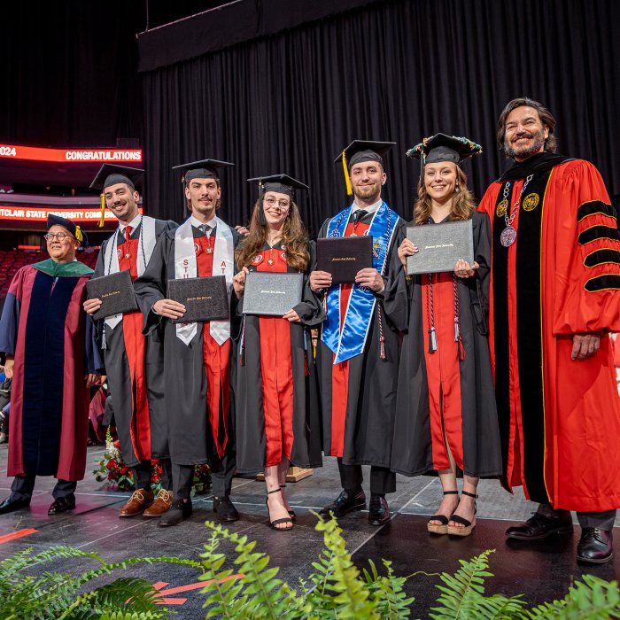 The Povolo quintuplets pose with President Koppell and Provost Junius Gonzales